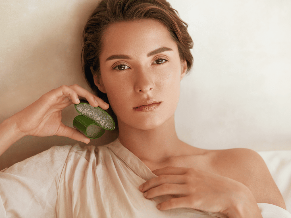 Beauty Portrait Of Woman With Aloe Vera Slices.