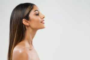 Woman's side profile with slim, contoured chin from Kybella in Denver